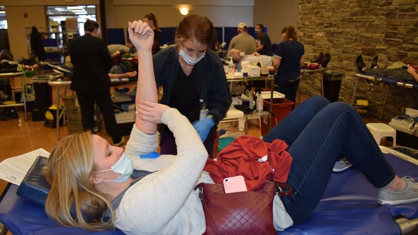 Gwen Eilerman gives blood on Tuesday at St. Michael’s Hall in Fort Loramie. CONTRIBUTED.