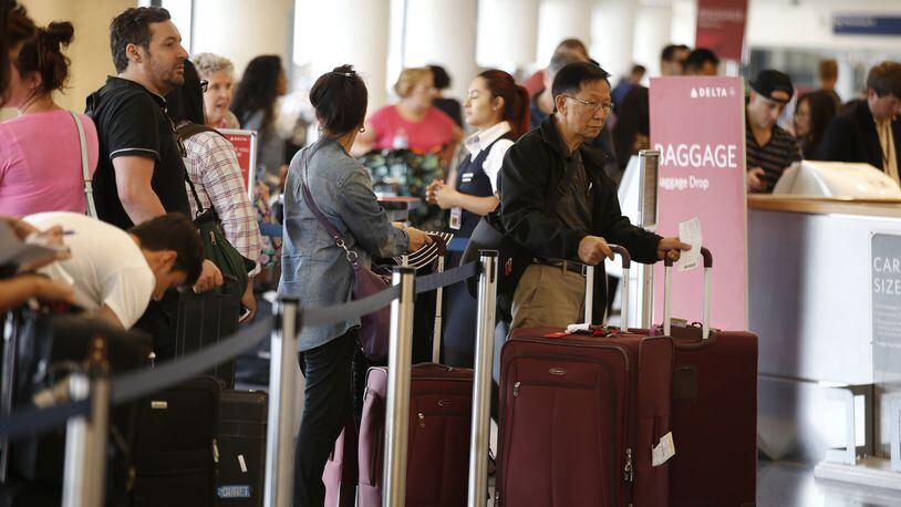 Travelers in Terminal 5 wait in long lines at the Delta Airlines counter at Los Angeles International Airport on the getaway day for the Labor Day holiday on Sept. 4, 2015. Industry leaders predict 16.5 million people will travel on U.S. carriers this holiday weekend. (Mark Boster/Los Angeles Times/TNS)