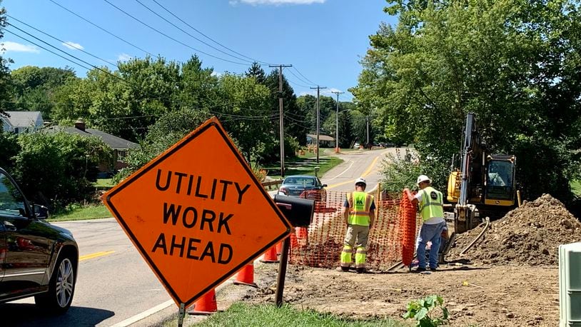 Construction workers on Shakertown Road in Beavercreek. The city's road widening project may begin as early as this fall. LONDON BISHOP/STAFF