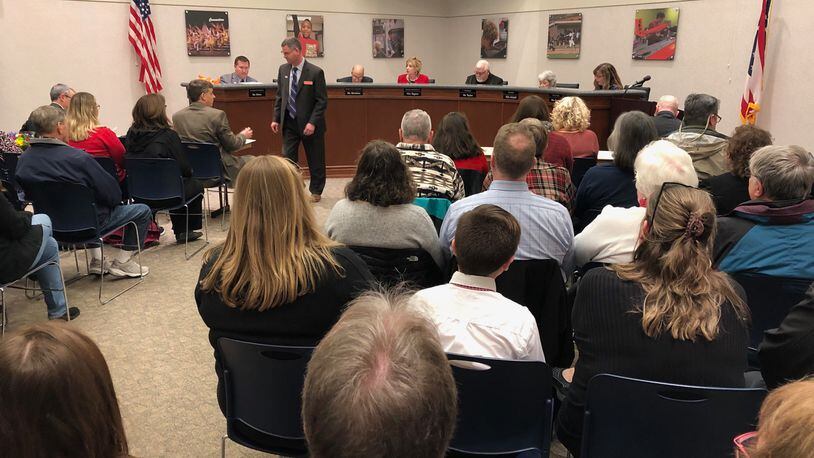 An overflow crowd attended this 2019 Beavercreek school board meeting, where the board was considering budget cuts. JEREMY P. KELLEY / STAFF