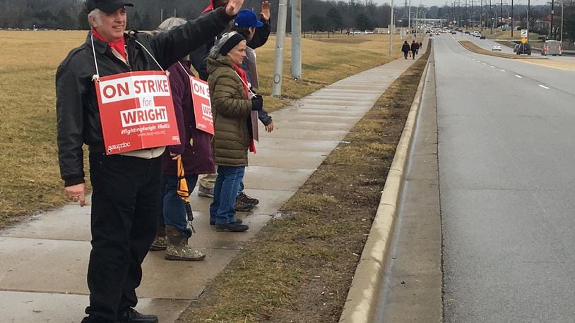 Picketers stand outside an entrance to the Dayton campus of Wright State University on Colonel Glenn Highway. The AAUP-WSU was on strike for 20 days this year.