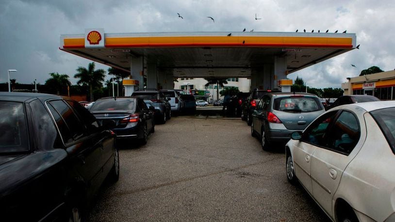Long lines at a gas station in West Miami on August 30, 2019, as residents prepare for Hurricane Dorian. The powerful storm is expected to bring high winds and dangerous storm surge when it makes landfall on the southeastern coastline next week.