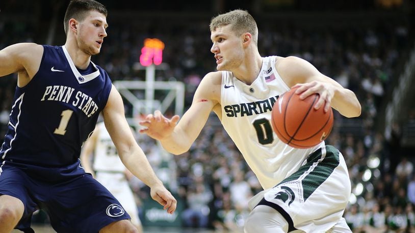 EAST LANSING, MI - FEBRUARY 28: Kyle Ahrens #0 of the Michigan State Spartans drives baseline against Deividas Zemgulis #1 of the Penn State Nittany Lions in the second half at the Breslin Center on February 28, 2016 in East Lansing, Michigan. (Photo by Rey Del Rio/Getty Images)