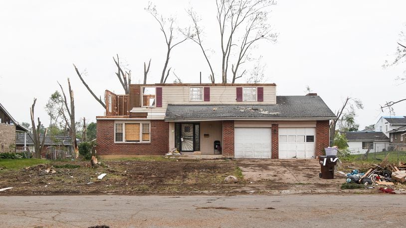 A tornado that ripped through Trotwood on Memorial Day took the roof off this Westcreek Drive house. CHRIS STEWART / STAFF