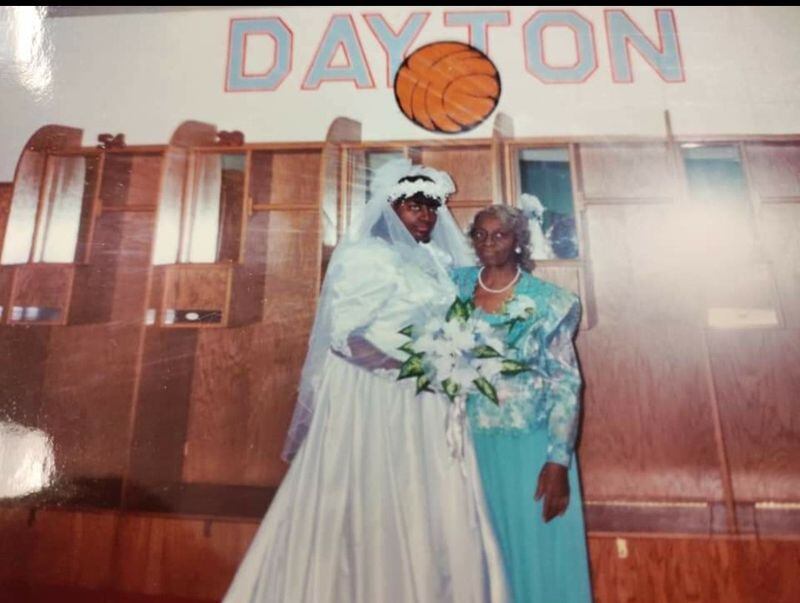Tobette Pleasant-Brown on her 1993 wedding day at UD Arena with her mother Betty. She was married at midcourt. Head coach Sue Ramsey was her maid of honor and her bridesmaids included assistant coach Tammy Stritenberger, former Flyers teammates Lisa Green and Kaihra Goodman and Trona Logan, the Central State star who had played at Dunbar and later coached at CSU. (CONTRIBUTED PHOTO)