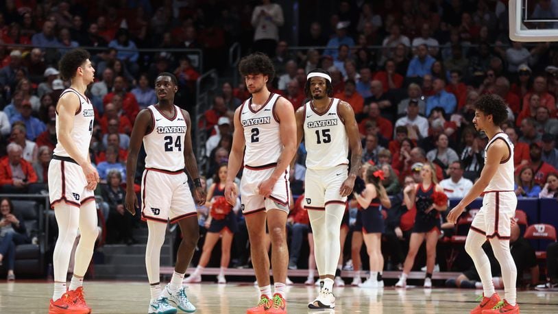 Dayton players return to the court after a timeout during a game against Davidson on Tuesday, Feb. 27, 2024, at UD Arena. David Jablonski/Staff
