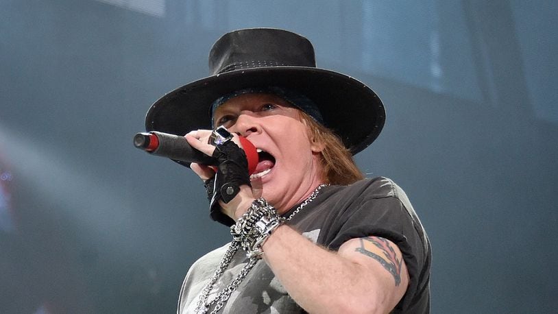 Axl Rose of Guns N' Roses surprised musician Pink when he brought her on stage for an impromptu duet of "Patience."