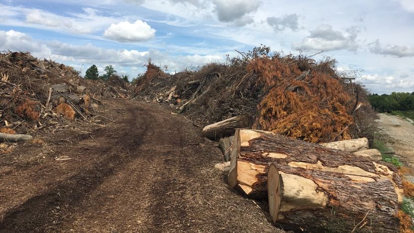 The tornado debris piled up at Greene County Environmental Services in Xenia measures about 74,000 cubic yards. The other pile at Cemex Park in Fairborn measures approximately the same, county officials said. RICHARD WILSON/STAFF