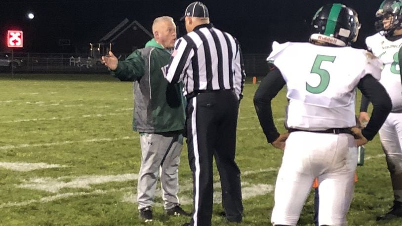 New Miami coach Jessie Hubbard argues a point with an official during Saturday night’s 41-0 loss to Fort Loramie in a Division VII, Region 28 playoff game at Redskin Stadium in Fort Loramie. RICK CASSANO/STAFF