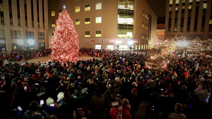 Crowds gathered for the Grande Illumination of the Christmas tree Friday night, Nov. 25, 2016, during the 2016 Dayton Holiday Festival on Courthouse Square in downtown Dayton.