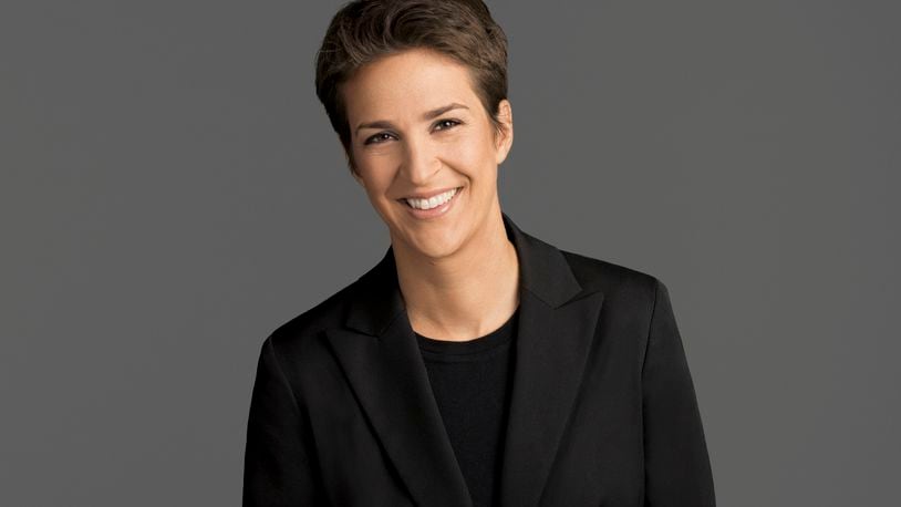 This image released by NBC shows Rachel Maddow, host of "The Rachel Maddow Show," on MSNBC. Maddow was at the center of the political media universe Tuesday, March 14, 2017, with a story on President Donald Trump’s tax returns. (MSNBC via AP)