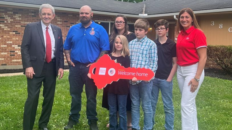 Cody Blevins, his wife Jessica Blevins and children Haiden, 13, Kaleb, 11 and Raelynn, 10, were surprised to be given a house in Dayton by the Military Warriors Support Foundation and Wells Fargo bank. | PROVIDED