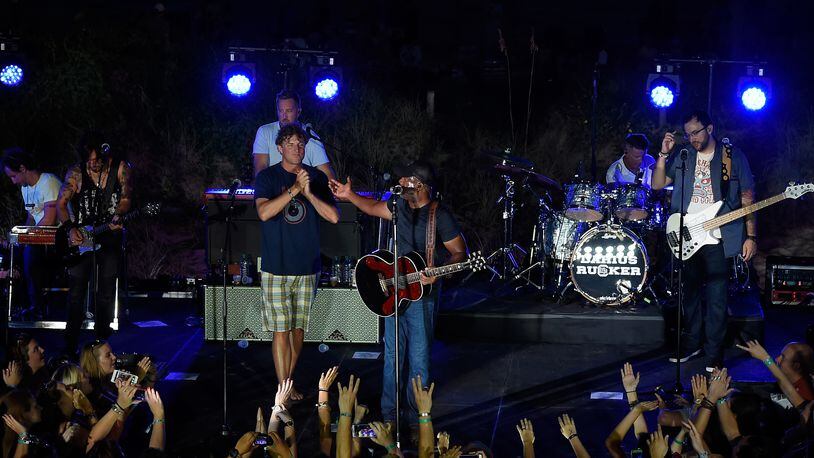 CHARLESTON, SC - AUGUST 26:  Mark Bryan (L) of Hootie & the Blowfish joins the stage with Darius Rucker to perform a free, surprise pop-up concert in Charleston for CMT INSTANT JAM: DARIUS RUCKER at The Windjammer on August 26, 2015 in Charleston, South Carolina. The concert premieres September 5 at 10/9c on CMT.  (Photo by Rick Diamond/Getty Images for CMT)