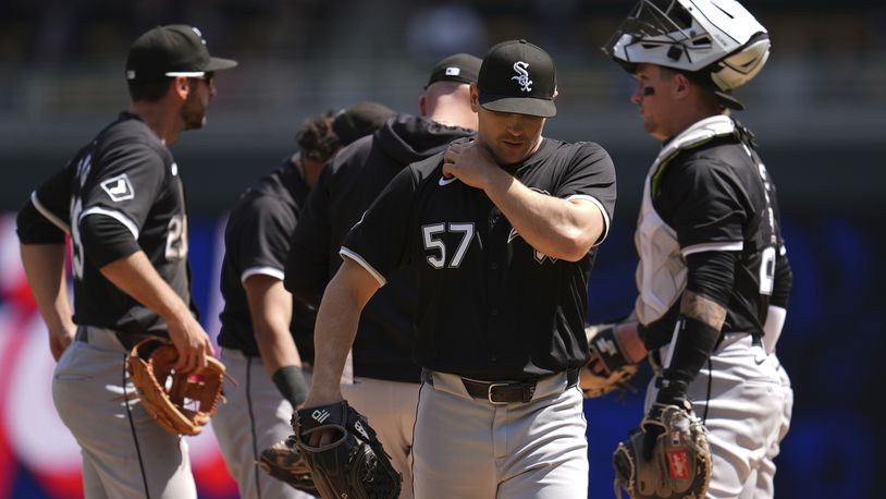 Chicago White Sox relief pitcher Tanner Banks (57) walks back to the dugout during a pitching change in the sixth inning of a baseball game against the Minnesota Twins, Thursday, April 25, 2024, in Minneapolis. (AP Photo/Abbie Parr)