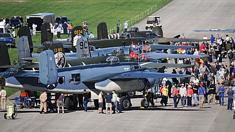 Spectators flocked to B-25s that landed at Wright-Patterson Air Force Base on Tuesday, April 18, 2017. The planes came to the National Museum of the U. S. Air Force as part of a celebration of the 75th anniversary of the Doolittle Raiders mission against Japan. MARSHALL GORBY / STAFF