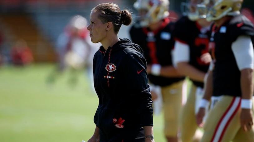 Katie Sowers, a coaching intern for the San Francisco 49ers, keeps an eye on training camp in Santa Clara, Calif., on Aug. 8, 2017. (Karl Mondon/Bay Area News Group/TNS)