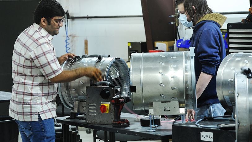 Aeroseal employees Charles Kumar, left, and Eric Levine, run tests on new products. MARSHALL GORBY\STAFF
