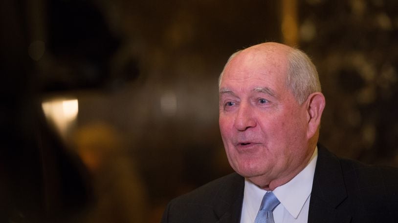 Former Georgia governor Sonny Perdue speaks to the media in the lobby of Trump Tower, November 30, 2016 in New York, after meetings with US President-elect Donald Trump. / AFP / Bryan R. Smith (Photo credit should read BRYAN R. SMITH/AFP/Getty Images)