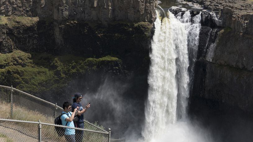 Visitors to Palouse Falls State Park view the falls from the safety of the designated viewing area Tuesday, May 30, 2017.  (Jesse Tinsley/SPOKESMAN-REVIEW/TNS)