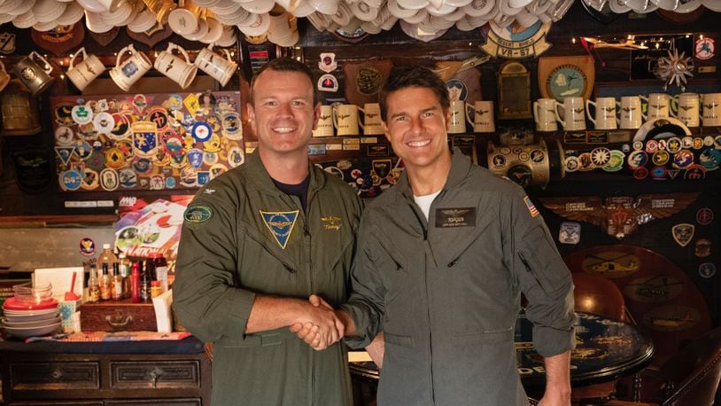 Northmont High graduate Tim Slentz, then commander of Naval Base Coronado near San Diego, meets Top Gun star Tom Cruise at the I-Bar on Naval Air Station North Island in October 2018. CONTRIBUTED PHOTO