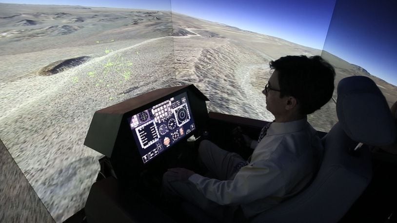 The Air Force Research Laboratory and its local allies are looking for new ways to connect to Dayton-area small businesses. In this 2015 photo, a flight simulator at Wright-Patterson Air Force Base is being used to test a mid-air collision avoidance system. TY GREENLEES / STAFF
