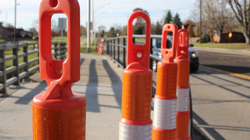 Orange plastic cones were placed on either ends of the Stroop Road bridge in Kettering. Another bridge in Kettering is set to be closed as replacements occur. CORNELIUS FROLIK / STAFF