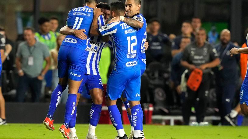 Monterrey midfielder Jorge Rodríguez, second from left, celebrates with midfielder Maximiliano Meza (11), forward Jesús Manuel Corona (12) and another teammate after scoring a goal against Inter Miami during the second half of a CONCACAF Champions Cup quarterfinal soccer match, Wednesday, April 3, 2024, in Fort Lauderdale, Fla. (AP Photo/Lynne Sladky)