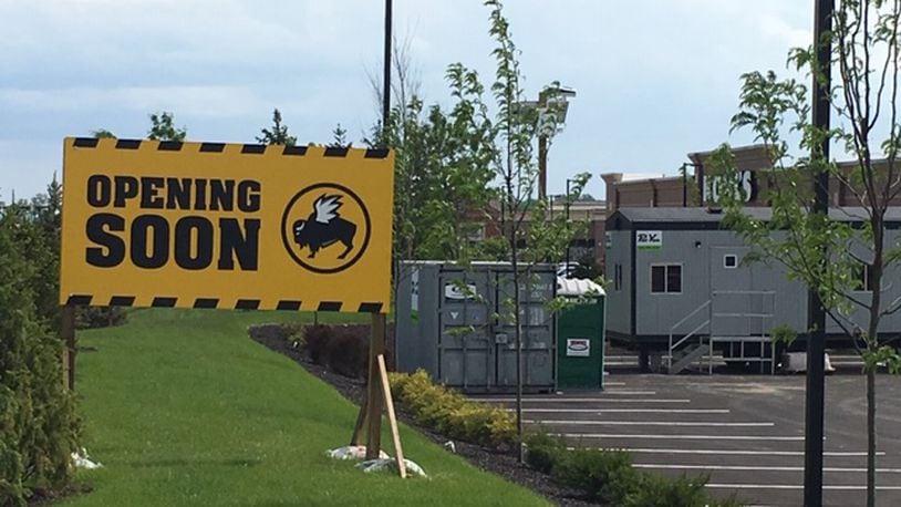 Work has started on the new Buffalo Wild Wings at Austin Landing. The projected opening, which includes the closing of the Springboro restaurant, is scheduled for September, according to company officials. NICK BLIZZARD/STAFF