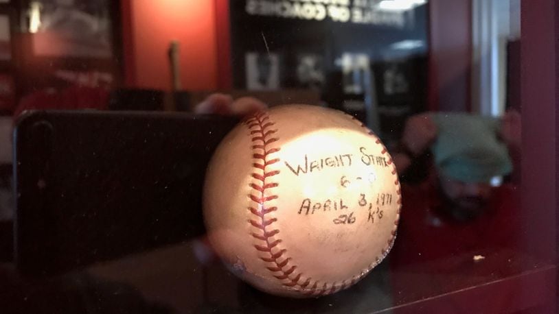 The baseball Buddy Schultz used in his NCAA record game 50 years ago. On April 3, 1971, the Miami left hander struck out 26 Wright State batters in a nine inning game. The record still stands today. The ball is now displayed, alongside a large photo of Buddy in the Toby K. Schultz Heritage Hallway inside the Jay Hayden Baseball Center on the Miami University campus. Tom Archdeacon/STAFF