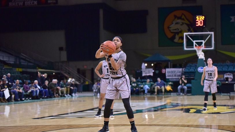 Senior guard Chelsea Welch prepares to shoot the free throw that netted her 1,000th point at Wright State during Monday afternoon at the Nutter Center against Youngstown State.