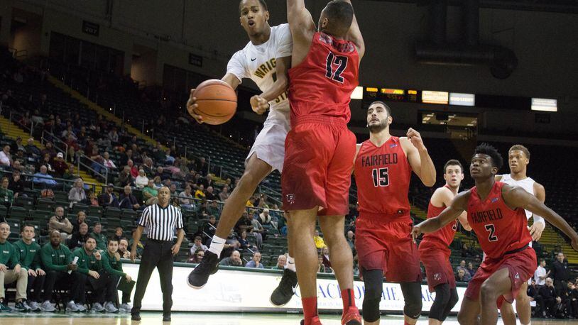 Wright State freshman Jaylon hall tries to make a pass around Fairfield’s Kevin Senghorne-Patterson during Sunday’s game at the Nutter Center. Allison Rodriguez/CONTRIBUTED