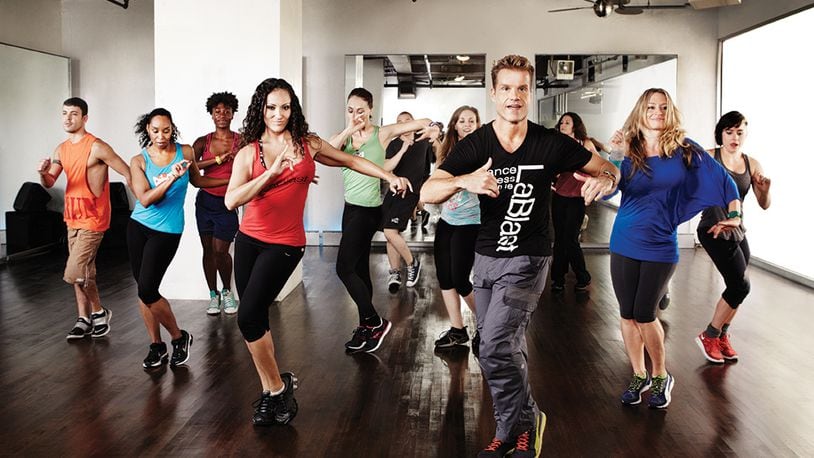 Dancing With the Stars pro Louis van Amstel (right of center) created LaBlast, a partner-free dance workout. CONTRIBUTED