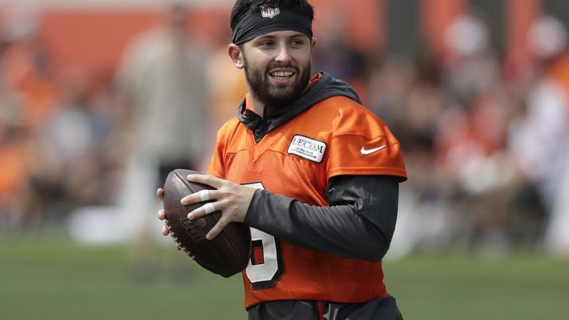 FILE - In this July 26, 2019, file photo, Cleveland Browns quarterback Baker Mayfield looks to throw during practice at the NFL football team’s training camp facility in Berea, Ohio. Mayfield isn’t concerned about the huge expectations being placed on the Browns, who went 7-8-1 during his rookie season but upgraded their roster and should compete for their first playoff spot since 2002. (AP Photo/Tony Dejak, File)
