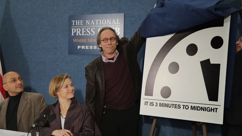 Arizona State University New Origins Initiative Director Lawrence Krauss (C) and Bulletin of the Atomic Scientists Science and Security Board member Thomas Pickering (R) unveil the latest version of the Doomsday Clock with Stockholm Environment Institute Senior Scientist Sivan Kartha (L) and Center for Strategic and International Studies' Proliferation Prevention Program Director Sharon Squassoni during a news conference at the National Press Club January 26, 2016 in Washington, DC. The bulletin's Science and Security Board takes into consideration 'the number and kinds of nuclear weapons in the world, the parts per million of carbon dioxide in the atmosphere, the degree of acidity in our oceans and the rate of sea level rise' when setting the clock as a warning against self-destruction.