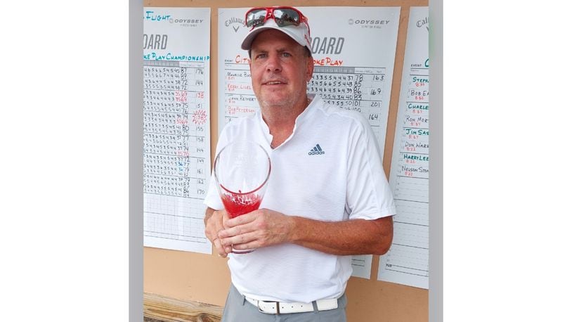 Kevin Flynn poses for a photo with the trophy after winning the Dayton Senior Championship in August 2022. Contributed photo