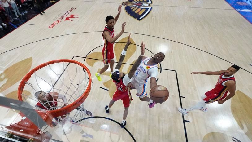 Oklahoma City Thunder forward Jalen Williams (8) goes to the basket against New Orleans Pelicans forward Brandon Ingram (14) in the first half of Game 3 of an NBA basketball first-round playoff series in New Orleans, Saturday, April 27, 2024. (AP Photo/Gerald Herbert)