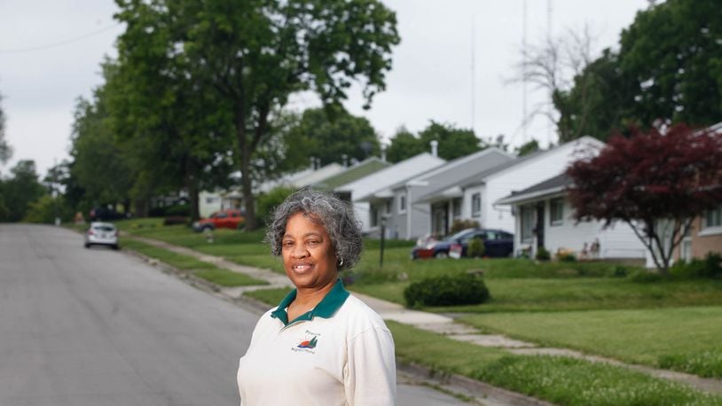 Lisa Parker Rucker, the former Pineview Neighborhood Association president, credits the Montgomery County Land Bank's Thriving Neighborhood Initiative with stabilizing the neighborhood by taking down several eyesores in the West Dayton community and renovating other homes. CHRIS STEWART / STAFF