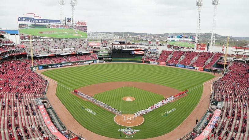 The Reds and Cardinals stand for the national anthem on Opening Day on Thursday, April 1, 2021, at Great American Ball Park in Cincinnati. David Jablonski/Staff