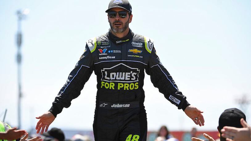 NASCAR driver Jimmie Johnson slaps hands with fans during driver introductions before the start of the Toyota/Save Mart 350 at Sonoma Raceway in Sonoma, Calif., on June 24, 2018. (Jose Carlos Fajardo/Bay Area News Group/TNS)