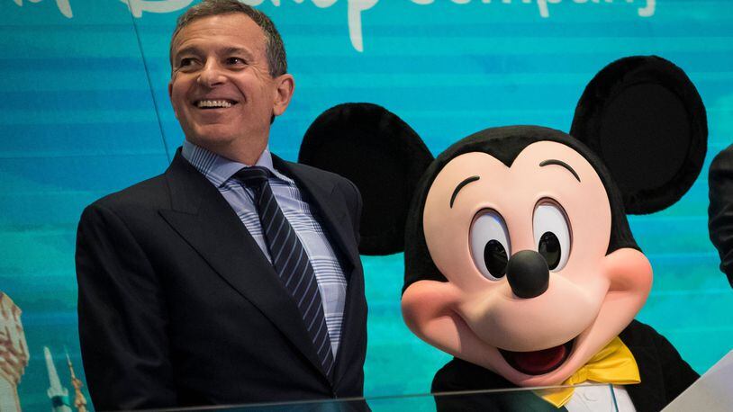 FILE PHOTO:  Chief executive officer and chairman of The Walt Disney Company Bob Iger and Mickey Mouse look on before ringing the opening bell at the New York Stock Exchange (NYSE), November 27, 2017 in New York City.