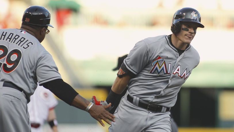 The Marlins’ Derek Dietrich rounds the bases after a home run against the Reds in the fourth inning on Saturday, June 20, 2015, at Great American Ball Park in Cincinnati. David Jablonski/Staff