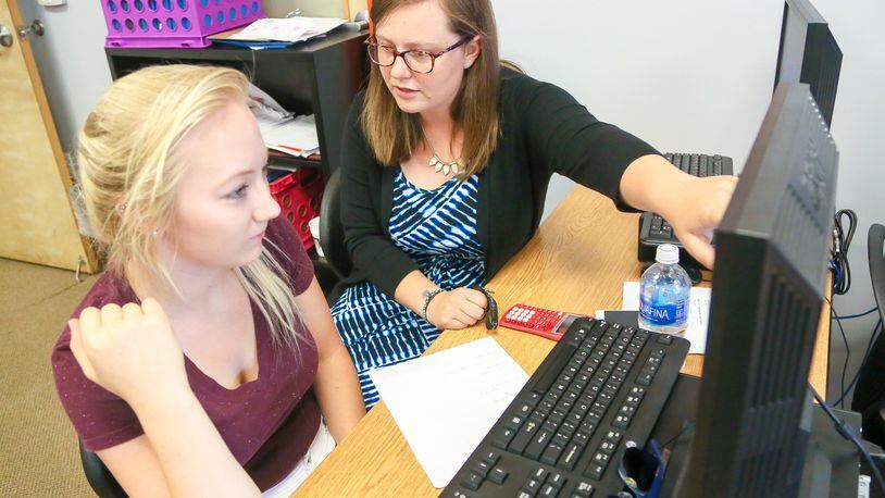 Marshall High School math teacher Skylar Folkens works with student Savannah Smith at the school, Tuesday, July 25, 2017. GREG LYNCH / STAFF Marshall High School english teacher Rachel Osterday works with student Shanae Davis at the school, Tuesday, July 25, 2017. GREG LYNCH / STAFF Marshall High School in Middletown is is celebrating its fifth year August with an open house. GREG LYNCH / STAFF Kelvin Moss talks about the future of Marshall High School, Tuesday, July 25, 2017. GREG LYNCH / STAFF