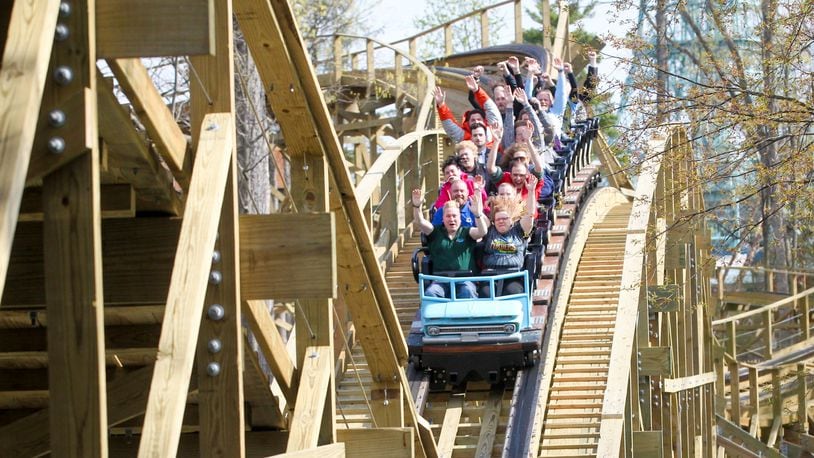Ride enthusists enjoy the wooden roller coaster, Mystic Timbers, at Kings Island. GREG LYNCH / STAFF