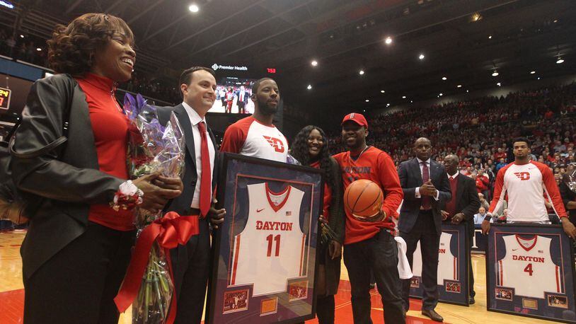 Dayton's Scoochie Smith and his family stand with Archie Miller on Senior Night on March 1, 2017, at UD Arena.
