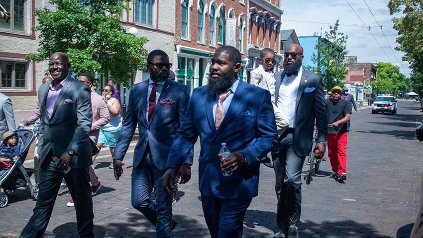 Photos: 300 men in suits march in Dayton