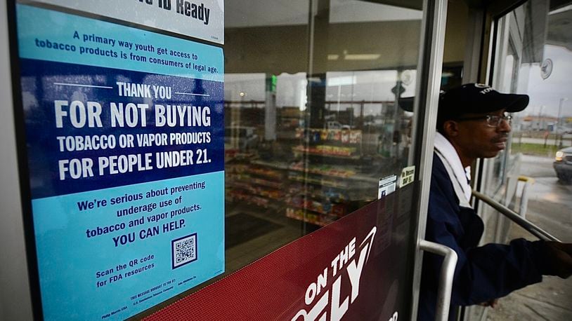 A signed on the door, thanking people not to buy tobacco or vaping products for people under the age of 21 at the BP station on Edwin C Moses Boulevard. MARSHALL GORBY \STAFF