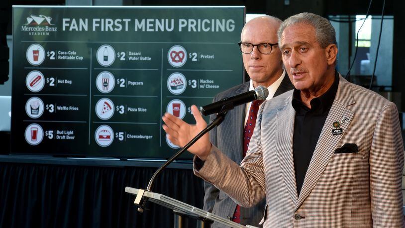 The Atlanta Falcons gave a preview of food set for the new Mercedes Benz Stadium on Wednesday. Atlanta Falcons owner Arthur Blank, right, and Falcons President Rich McKay earlier this year unveiled a plan to buck sports-industry tradition by sharply reducing prices on some popular food and beverage items at the new venue. BRANT SANDERLIN/BSANDERLIN@AJC.COM