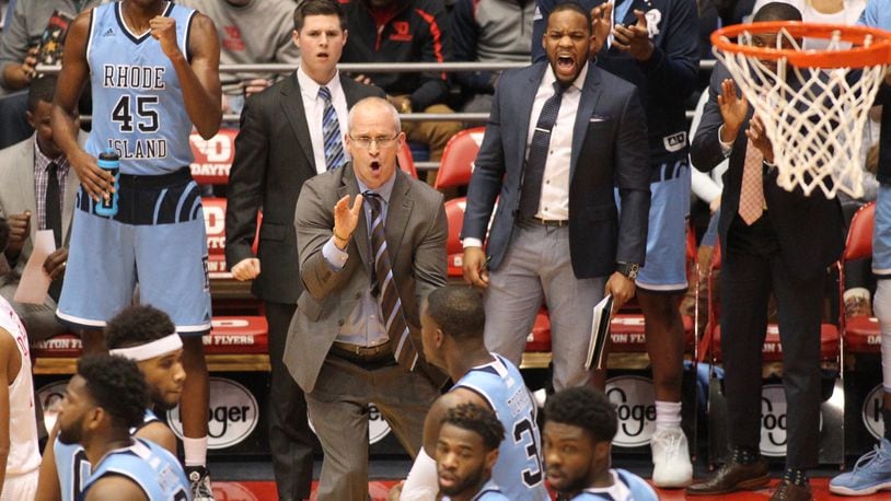 Rhode Island coach Dan Hurley claps after a stop by his team against Dayton in the first half. DAVID JABLONSKI / STAFF