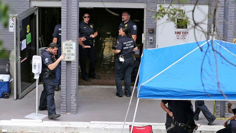 A Sept. 13, 2017 file photo shows a police staging area at the south entrance of the Rehabilitation Center at Hollywood Hills where residents died, in Hollywood, Fla.