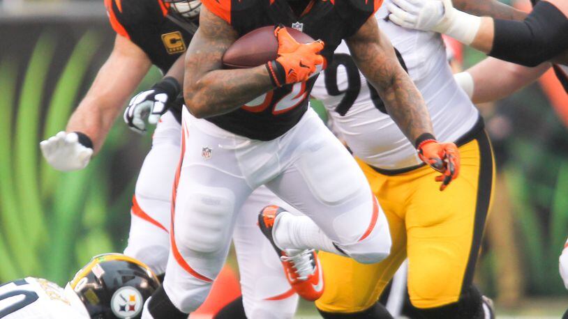 Cincinnati running back Jeremy Hill (32) looks for room to run during the first half of their game against the Steelers at Paul Brown Stadium in Cincinnati, Sunday, Dec. 13, 2015. GREG LYNCH / STAFF